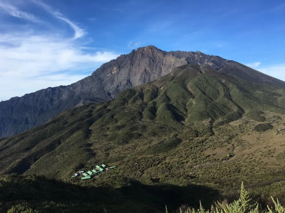 Mount Meru rising above green foothills near Arusha